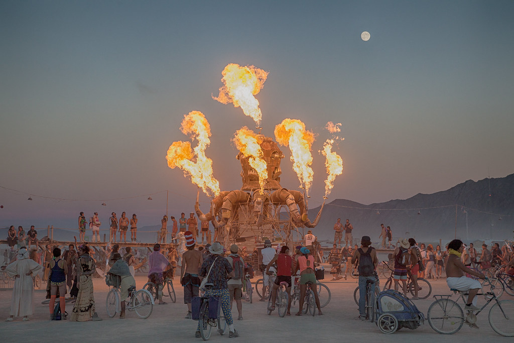 Participants enjoying art and unique costumes at the Burning Man Festival